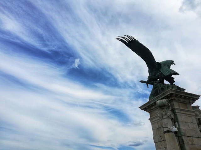 There is the statue of an eagle, that is ready to fly in the sky.